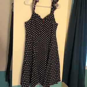 Blue and white polkadot sundress, with red accents